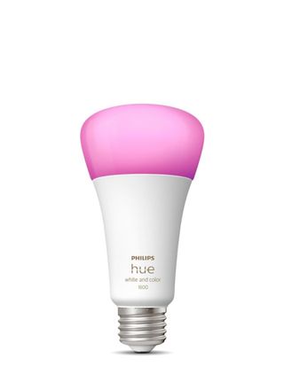 Philips Hue White and Color Ambiance Light Bulb displaying a pink color on a white background.