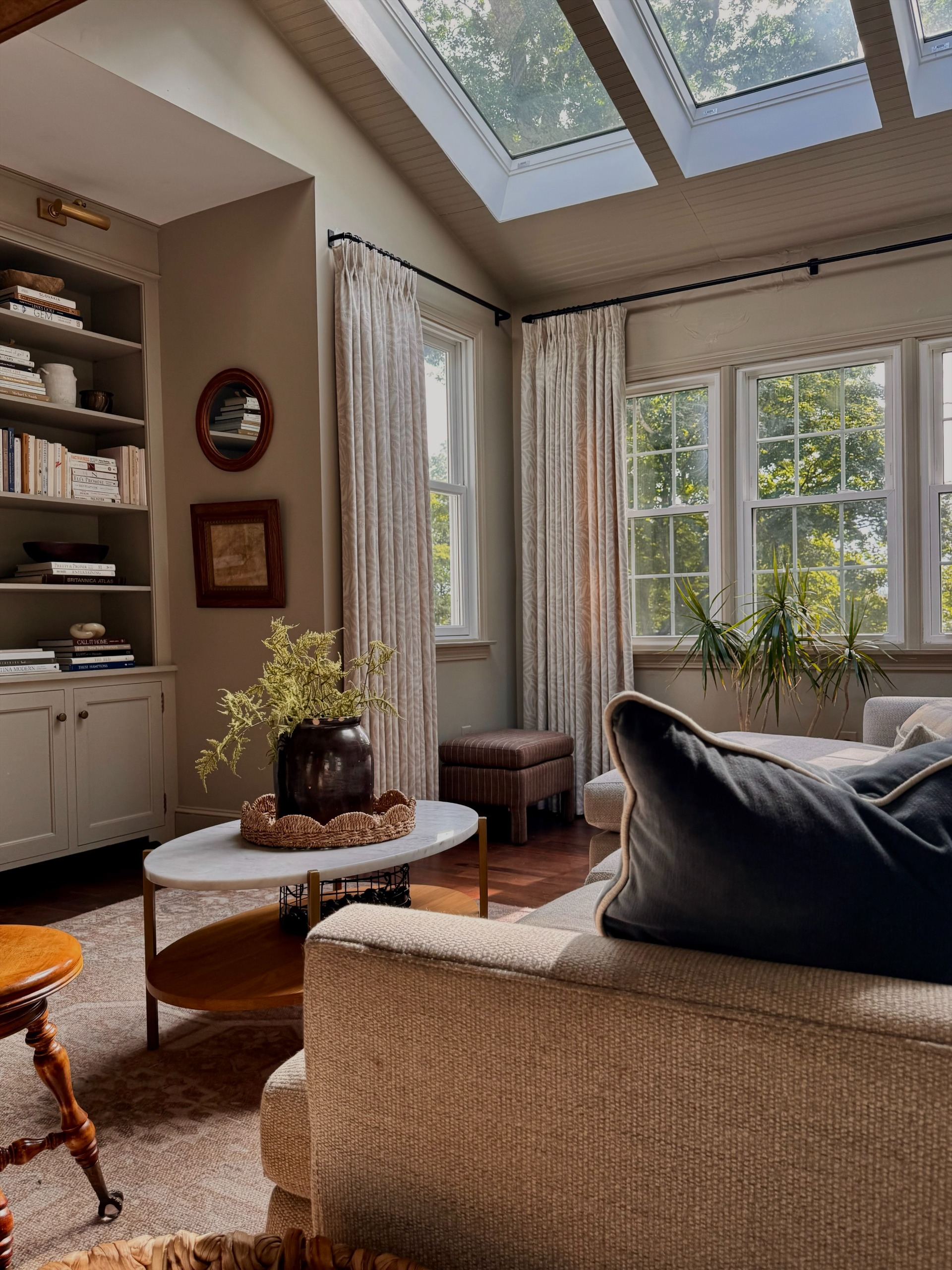living room with built in and velvet pillow covers
