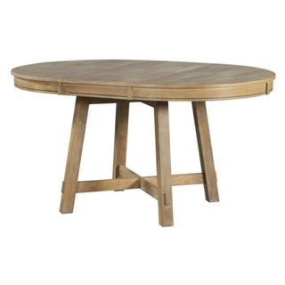 An oval wood table in a natural wood color