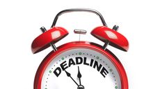 A red alarm clock says "deadline" across the top as the hands move toward midnight.