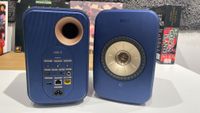 KEF LSX II speakers in blue finish placed on desk