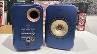 KEF LSX II speakers in blue finish placed on desk