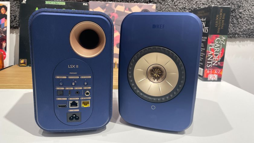 KEF LSX II speakers in blue finish placed on desk