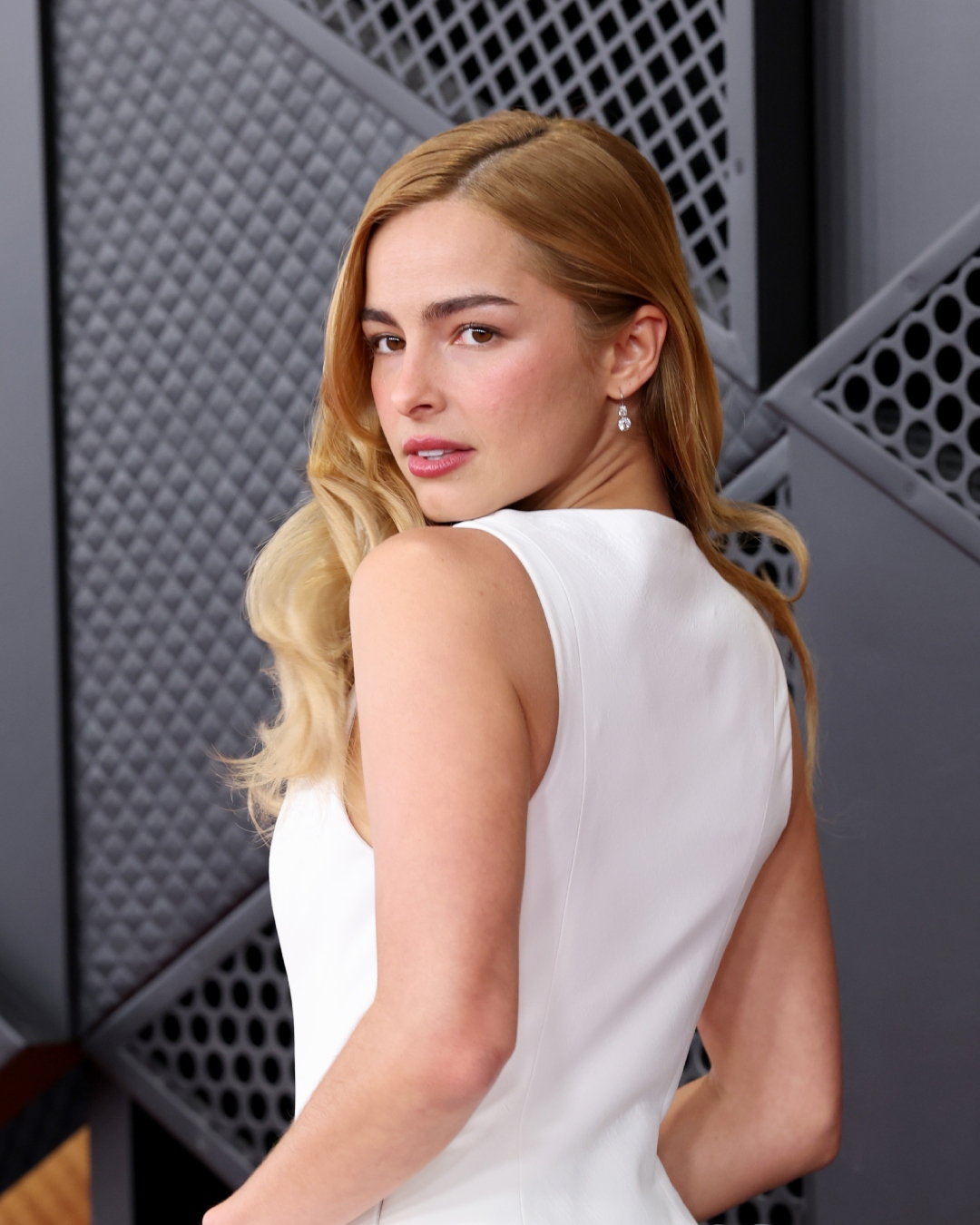 Addison Rae with petal pink lips and Old Hollywood waves at the 2026 Grammy Awards