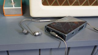 SoundMagic E80D inserted into FiiO M11S music player