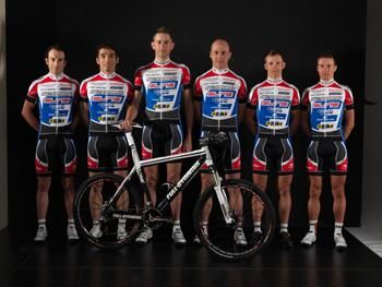 The Full Dynamix Team poses with one of its bikes.
