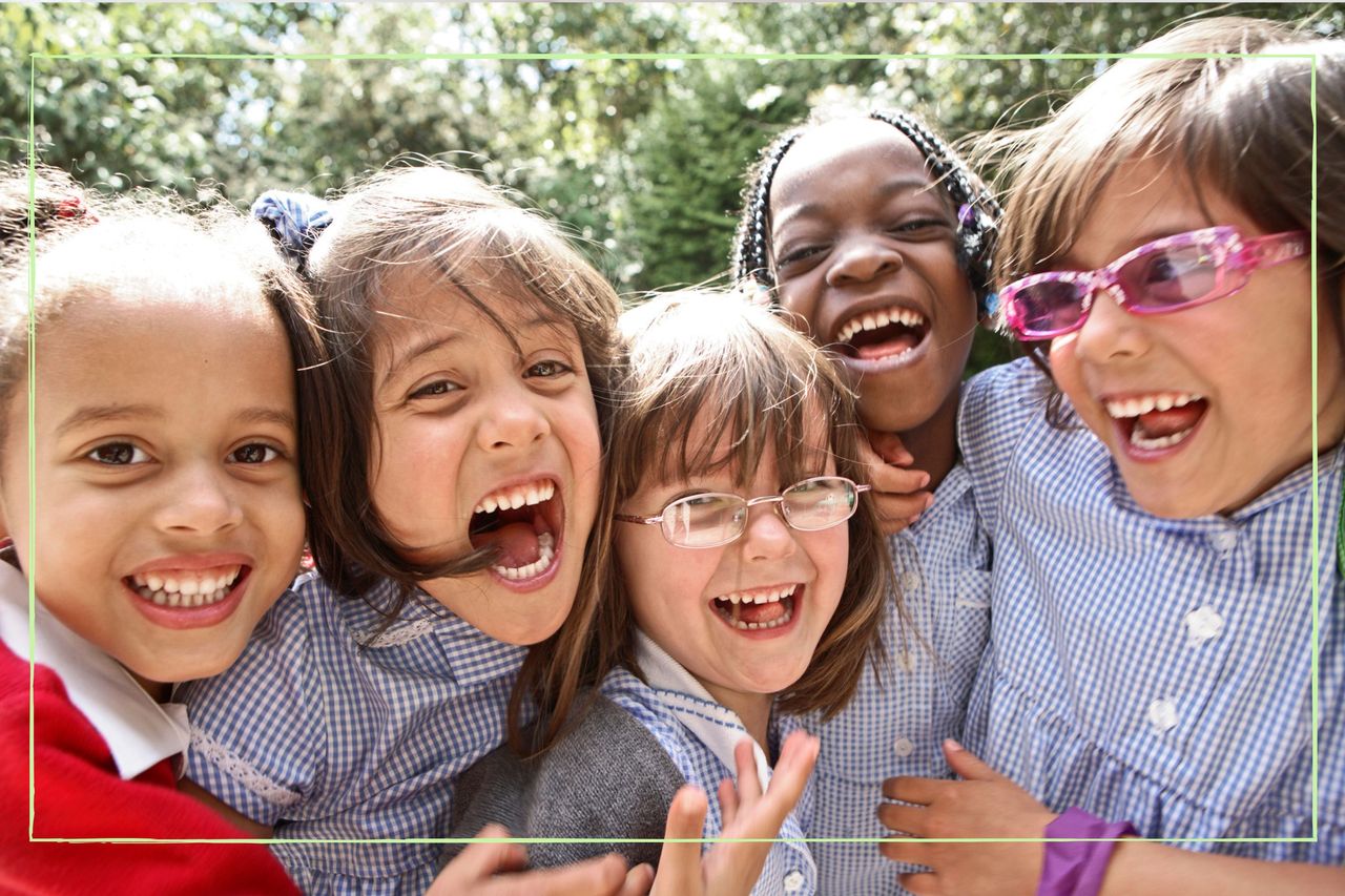 Group of school children laughing together