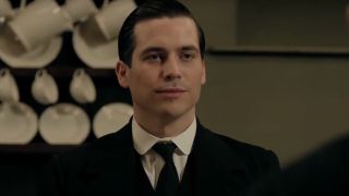 Rob James-Collier smirks after snarking someone in the kitchen in Downton Abbey.