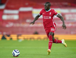 Liverpool’s Sadio Mane runs with the ball