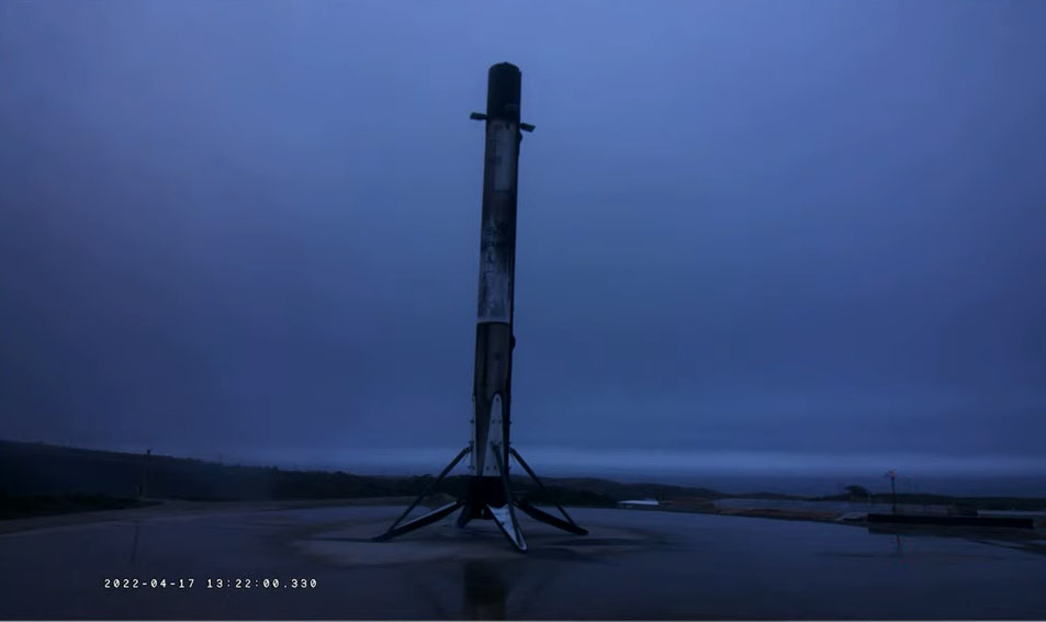 SpaceX's Falcon 9 rocket first stage stands atop its landing pad at Vandenberg Space Force Base in California after successfully launching the NROL-85 spy satellite into orbit on April 17, 2022.