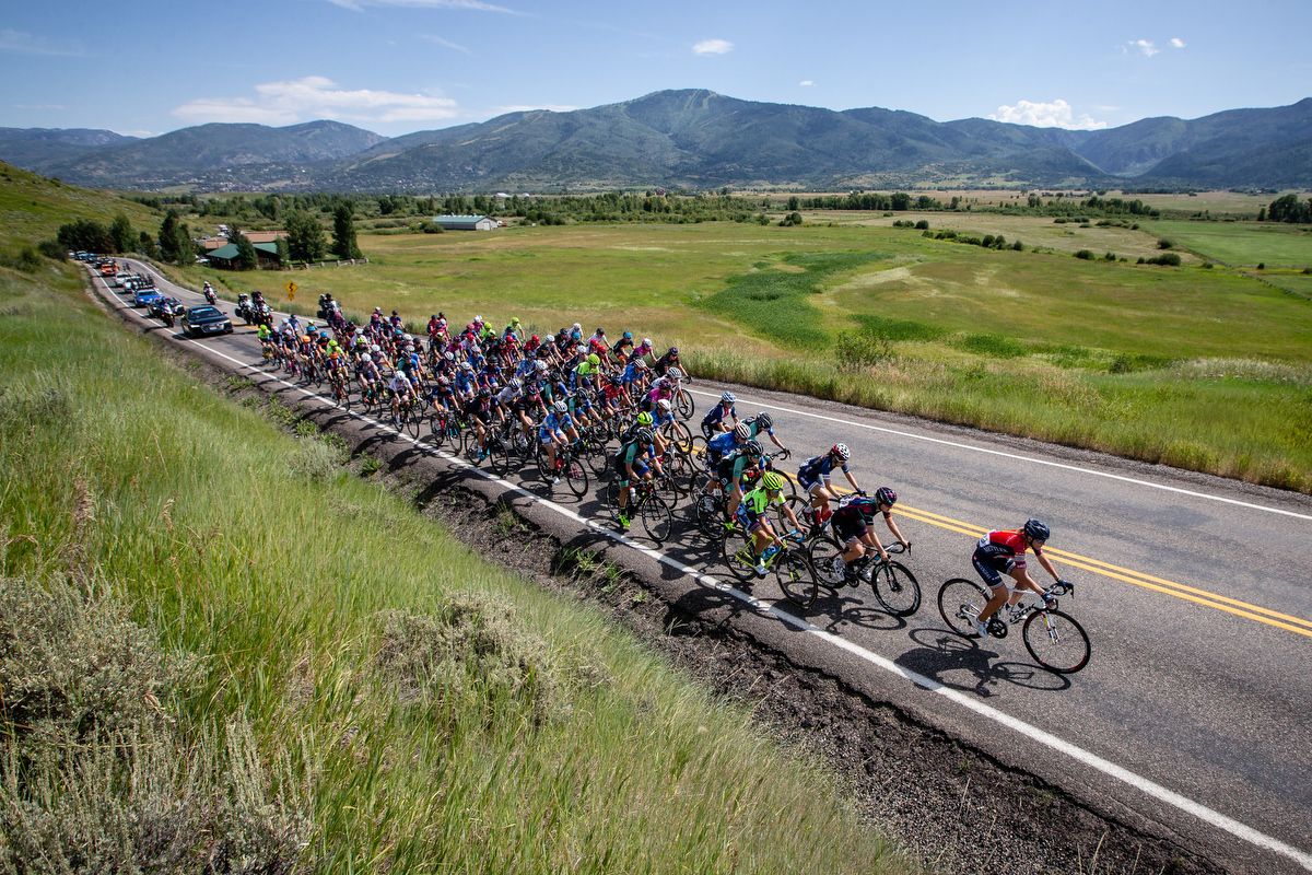 The womens peloton rolls along with Steamboat in the background at the beginning of stage 1 of the Colorado Classic on August 22, 2019 in Steamboat Springs, Colorado.