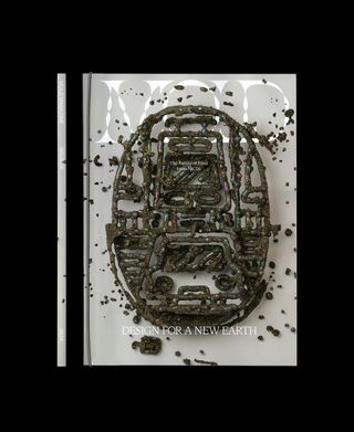 The cover of a magazine reads MOLD: DESIGN FOR A NEW EARTH in white against an abstract image showing a sculptural piece in what looks like mud-covered metal.