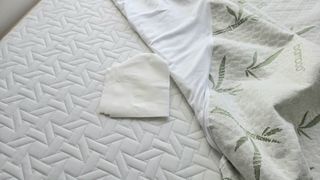 The clean absorbent towel underneath the Utopia Bedding bamboo mattress protector