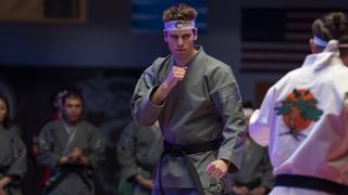 Patrick Luwis as Axel in Cobra Kai