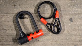 Abus Ultimate 420 + Loop Cable bike lock ona concrete floor