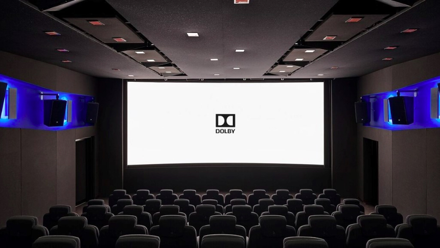 A cinema screen showing the Dolby Atmos logo