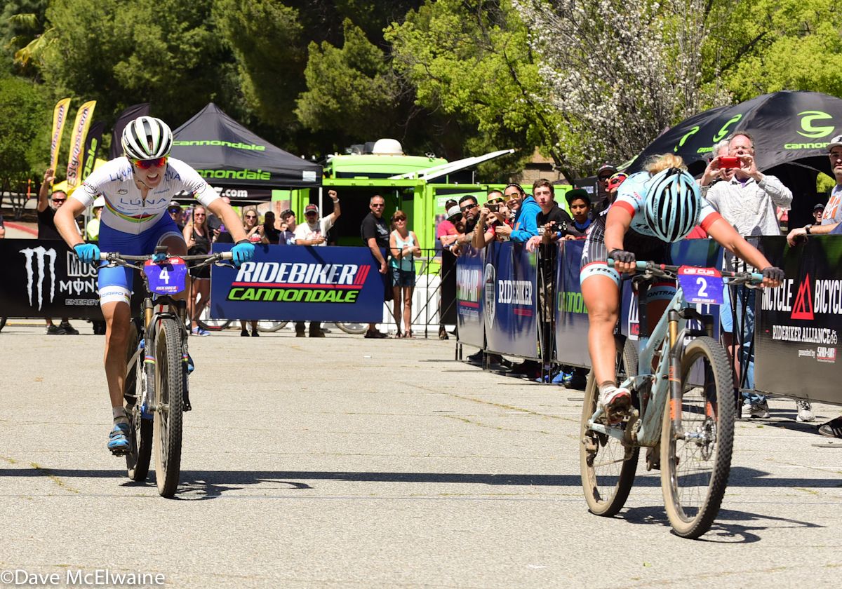 Emily Batty (Trek Factory Racing) throws her bike over the line to win at Bonelli Park