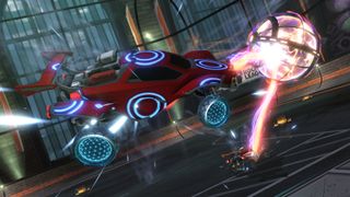 A car nudges a ball in Rocket League, one of the best free PS5 games