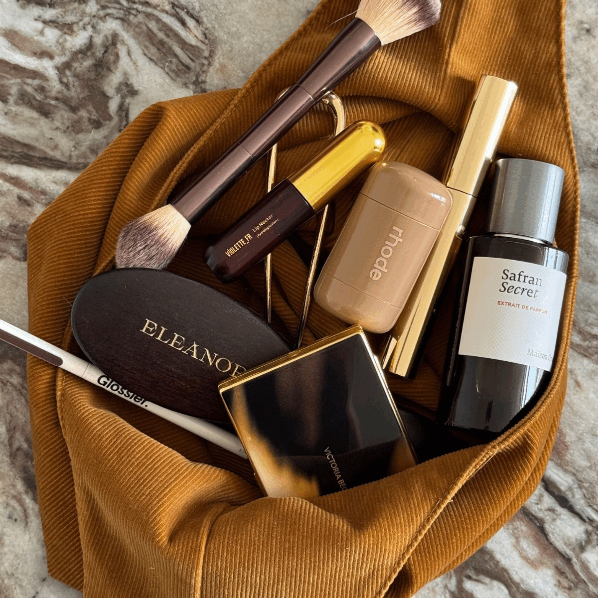 A gif with different editors' makeup bags