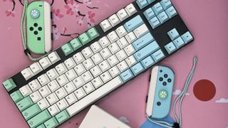 Glorious GMMK TKL mechanical keyboard with PBT Islander keycaps and Animal Crossing Nintendo Switch Joy-Cons