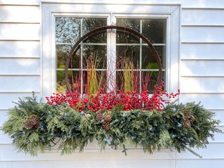 window box with evergreens and berries