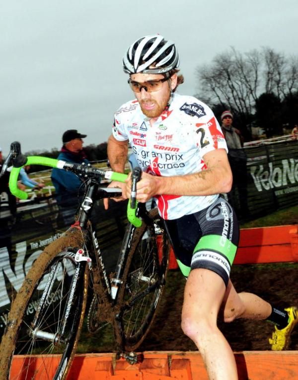 Jamey Driscoll (Cannondale-Cyclocrossworld.com) running the barriers.