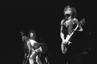 Ozzy Osbourne band performs on stage on the 'Blizzard Of Ozz' tour, United Kingdom, September-October 1980. (L-R) Bob Daisley (bass), Ozzy Osbourne (vocals), Randy Rhoads (guitar)