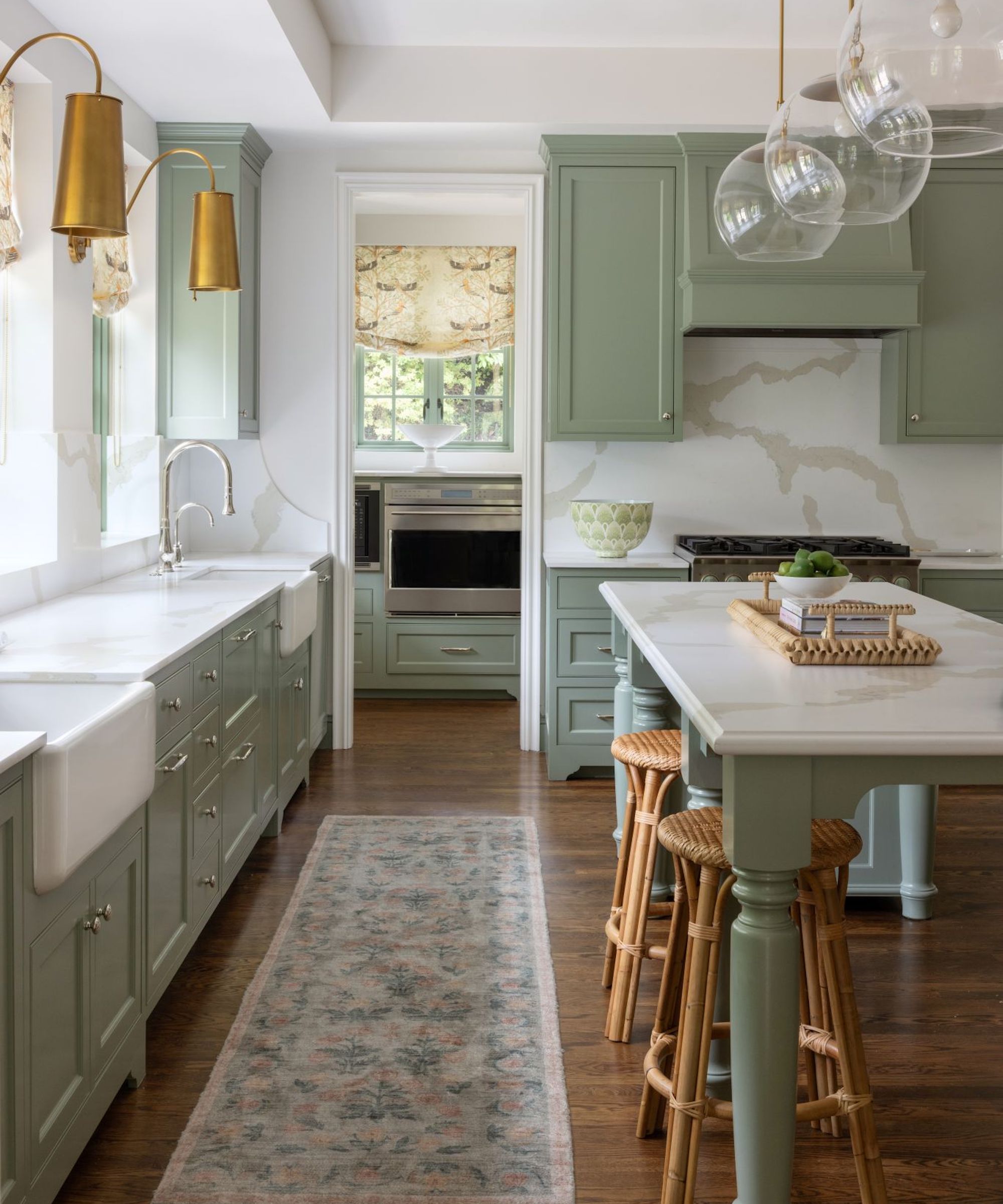 green kitchen with quartz worktops