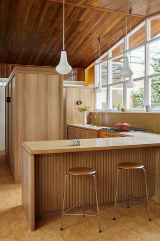 A mid-century kitchen style using wood panelling