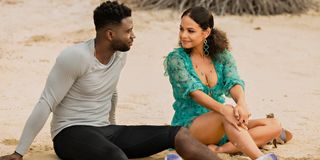 Sinqua Walls and Christina Milian flirting on the beach as Caleb and Erica in Resort to Love