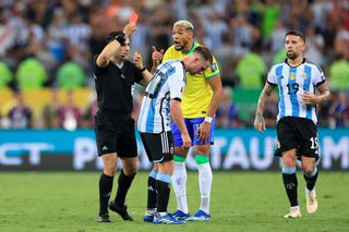 Referee Piero Maza shows a red card to Joelinton of Brazil during a FIFA World Cup 2026 Qualifier match between Brazil and Argentina at Maracana Stadium on November 21, 2023 in Rio de Janeiro, Brazil.