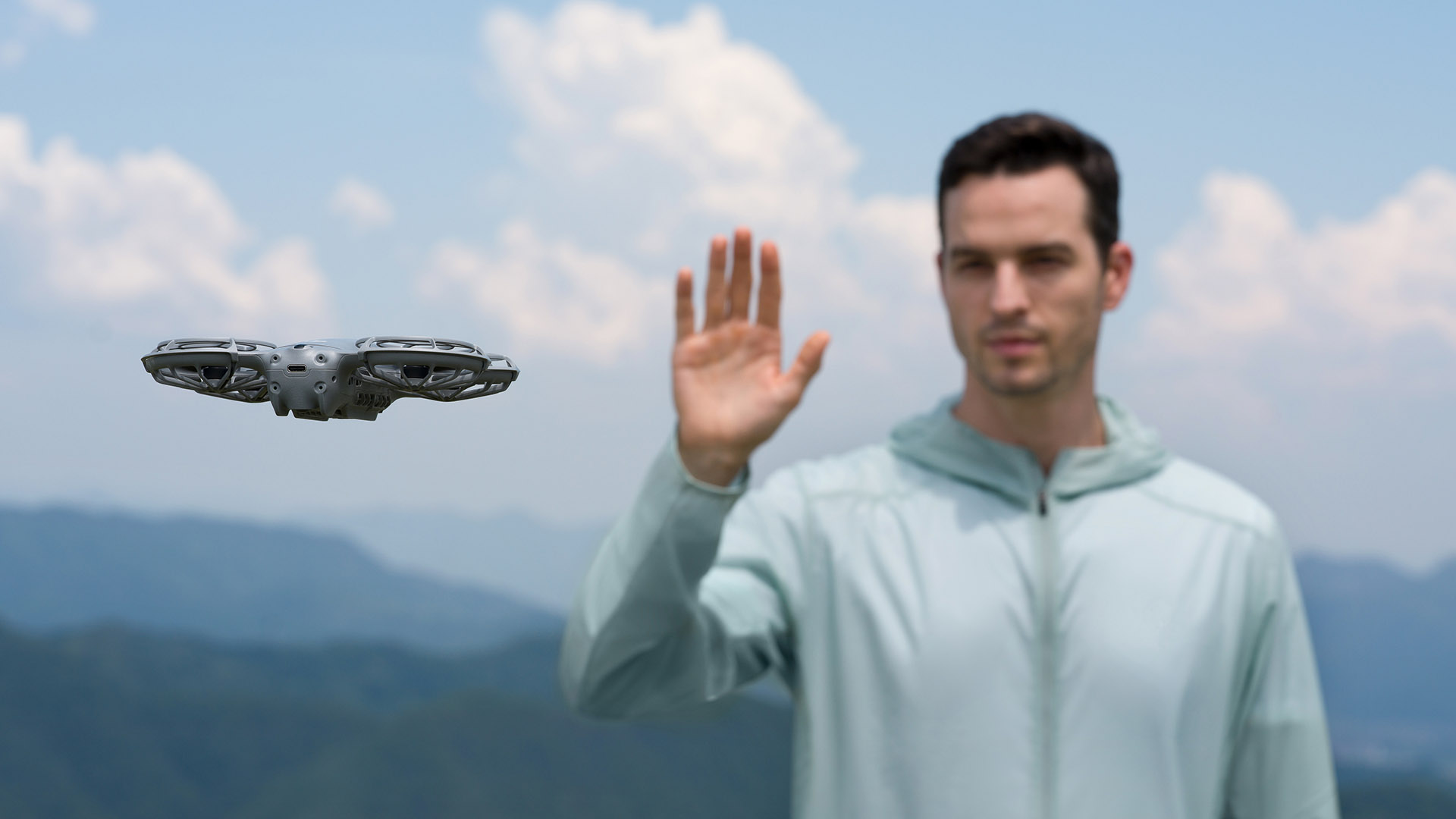 A person using the DJI Neo 2&#039;s gesture control.