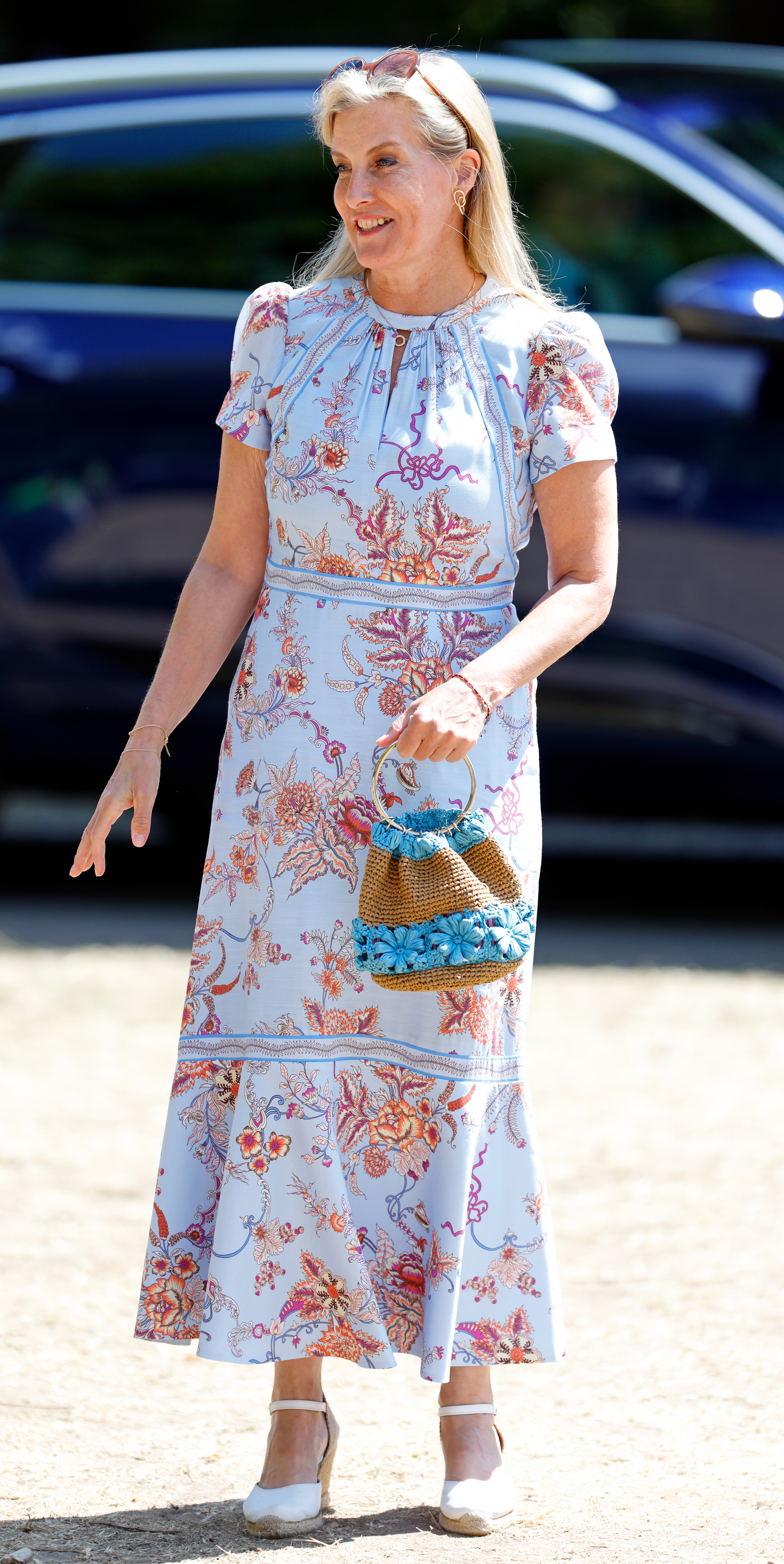 Duchess Sophie wearing a blue floral dress and smiling
