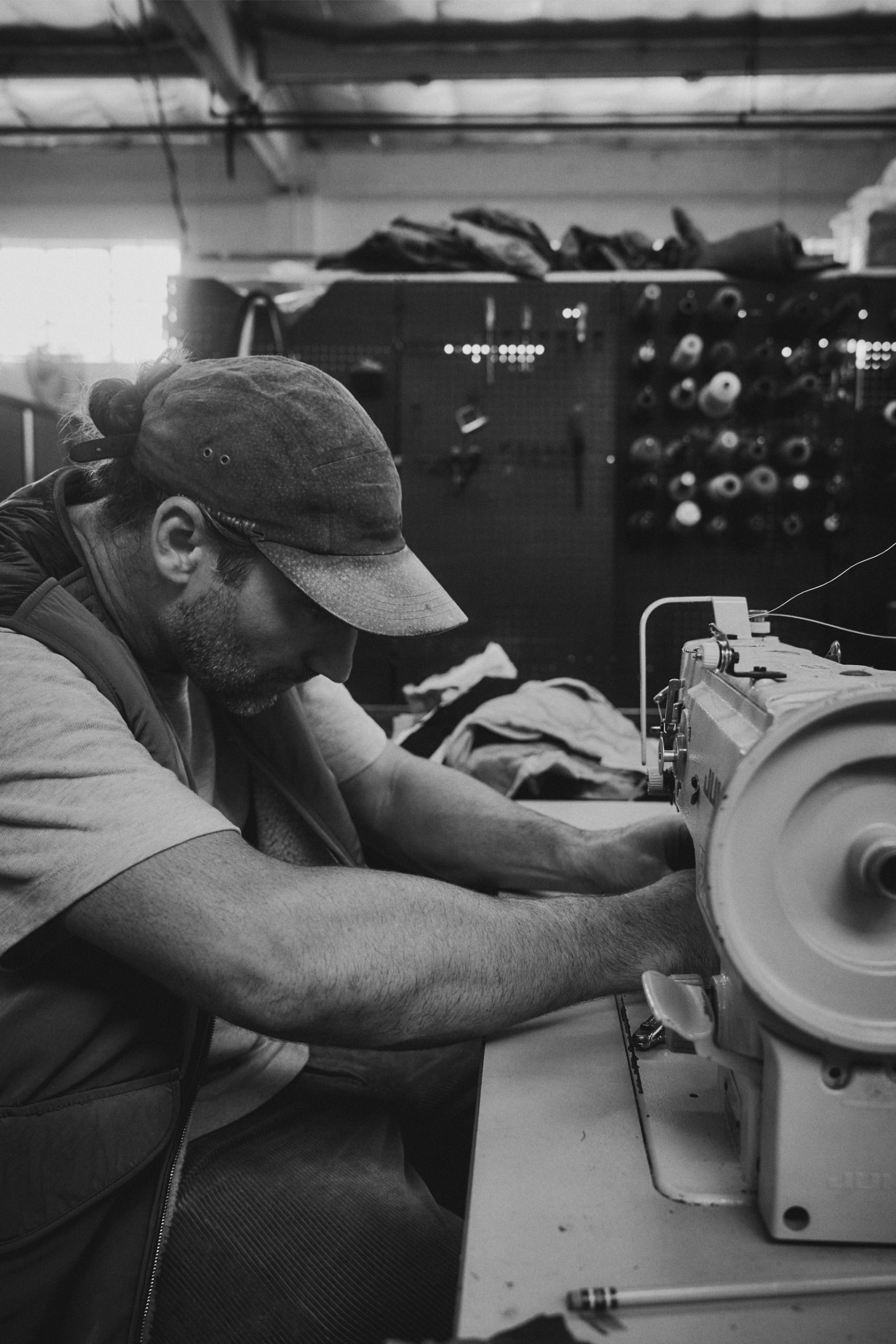 Stephen Kenn with sewing machine in his workshop