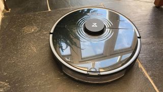 Roborock S7 review: A photo of the cleaner used on our dark kitchen flooring during testing