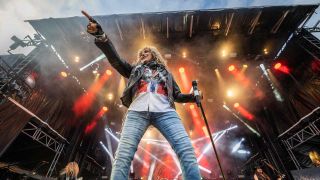 David Coverdale onstage pointing his finger