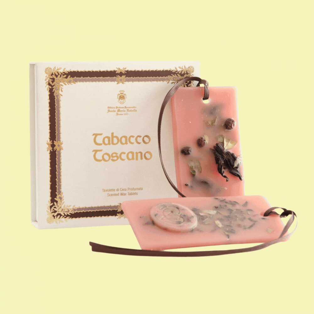 Santa Maria Novella Tabacco Toscano Wax Tablets against pale yellow background.