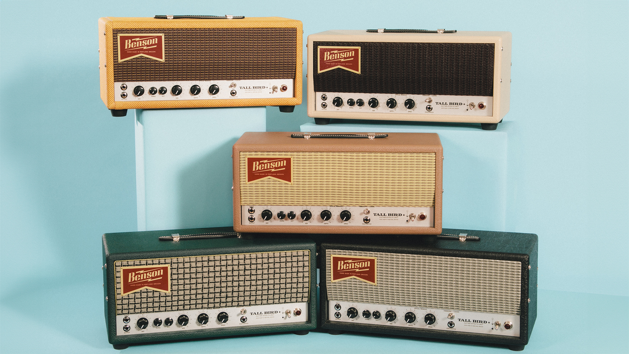 A photo showing five Benson Tall Bird Plus reverb-tremolo units in a range of colored Tolex coverings