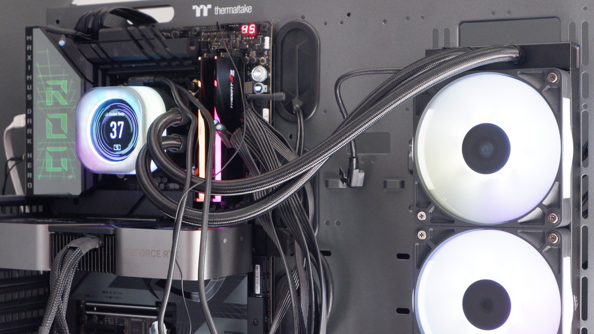 Corsair iCUE Link Titan 360 RX LCD liquid cooler set up on a test bench.