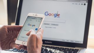 person on google homepage on mobile and desktop