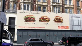 An ad for Burger King in a street in London