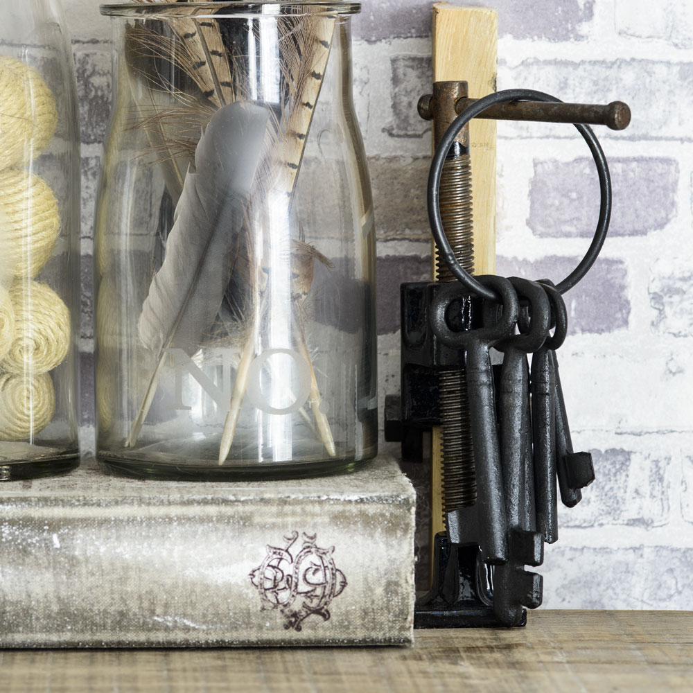 glass jars with feathers and keys
