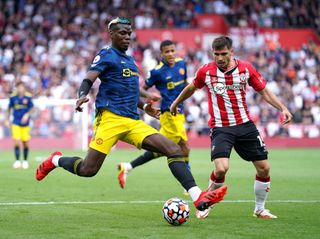 Manchester United’s Paul Pogba (left) and Southampton’s Romain Perraud battle for the ball during the Premier League match at St. Mary’s Stadium, Southampton. Picture date: Sunday August 22, 2021