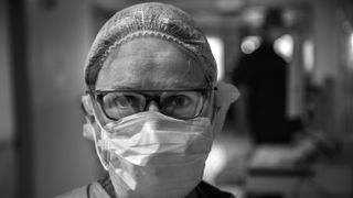 Emily Rostkowski - an oncology nurse and cancer survivor - wearing mask