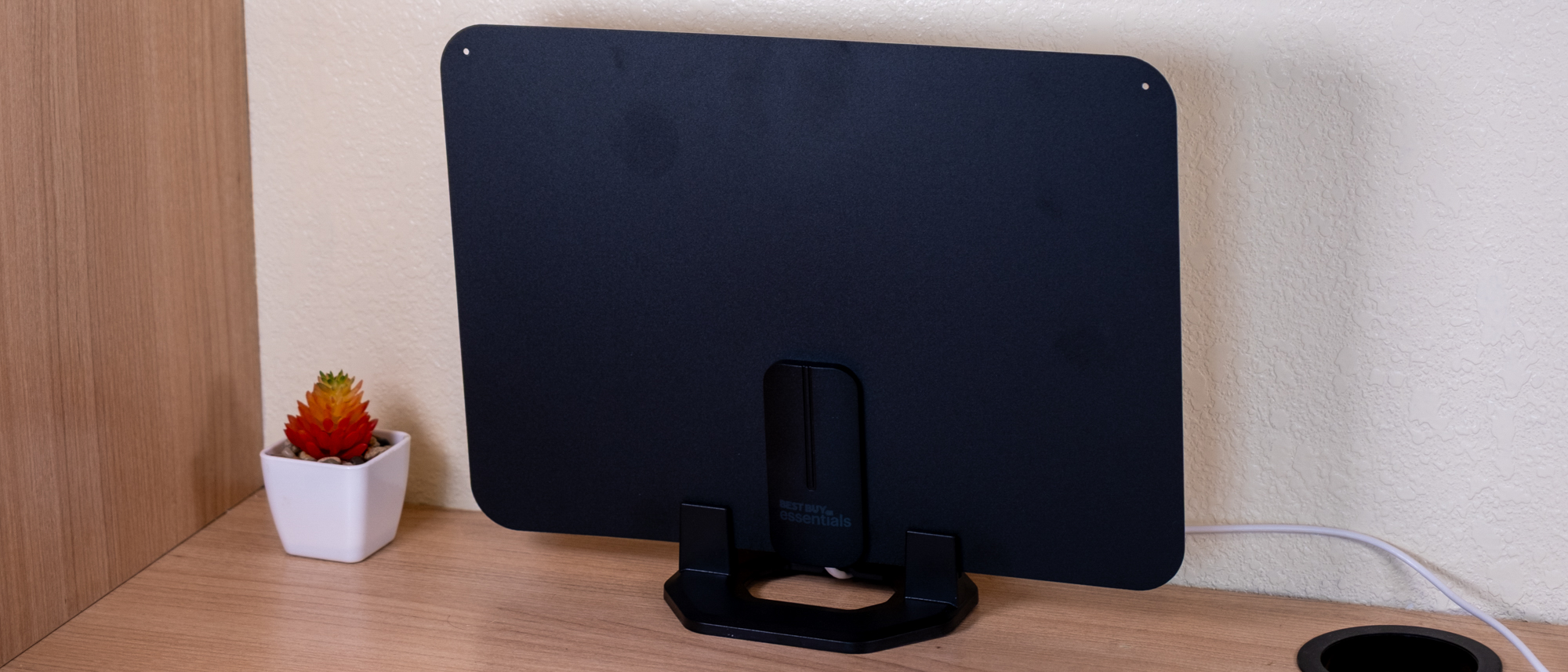 The Best Buy Essentials antenna on a desk.