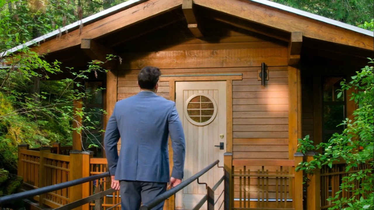 A man about to walk into a tree house in Age of Attraction.