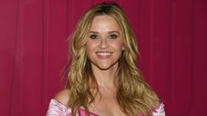 Reese Witherspoon is pictured wearing a pink dress and with wavy hair at the "Elle World" Official Photocall held at Hall des Lumi&egrave;res on June 20, 2026 in New York, New York. 