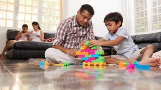 Father and son playing with blocks.