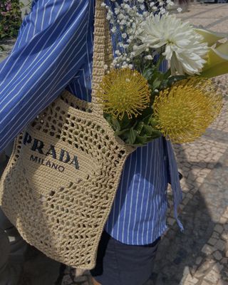 Debora Rosa wearing the Prada Raffia Tote.