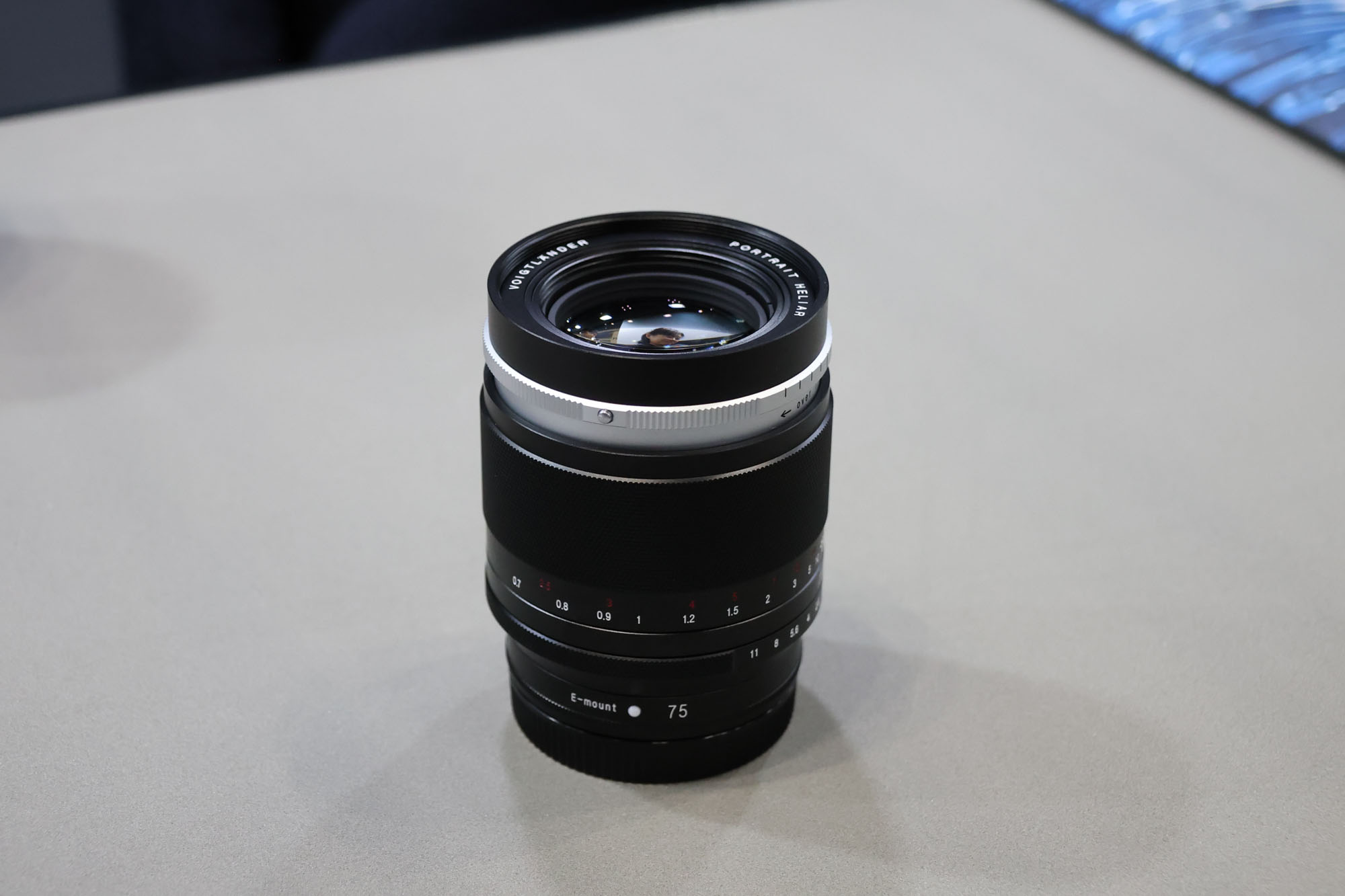 Voigtlander Heliar 75mm f/1.8 lens on a table at the CP+ show